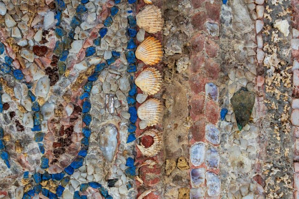 A close-up photo showing the rocks, shells and other materials used in the mosaic.