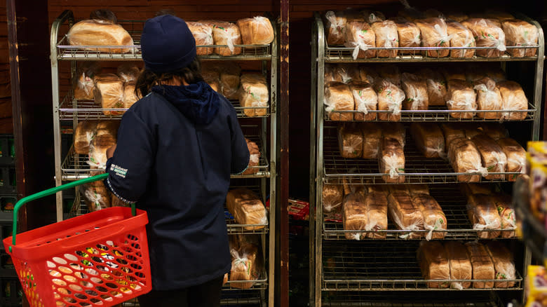 Shopping for bread at grocery store