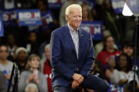 FILE - In this Feb. 29, 2020, file photo Democratic presidential candidate former Vice President Joe Biden smiles at supporters during a campaign event at Saint Augustine's University in Raleigh, N.C. Biden has won the last few delegates he needed to clinch the Democratic nomination for president. (AP Photo/Gerry Broome, File)