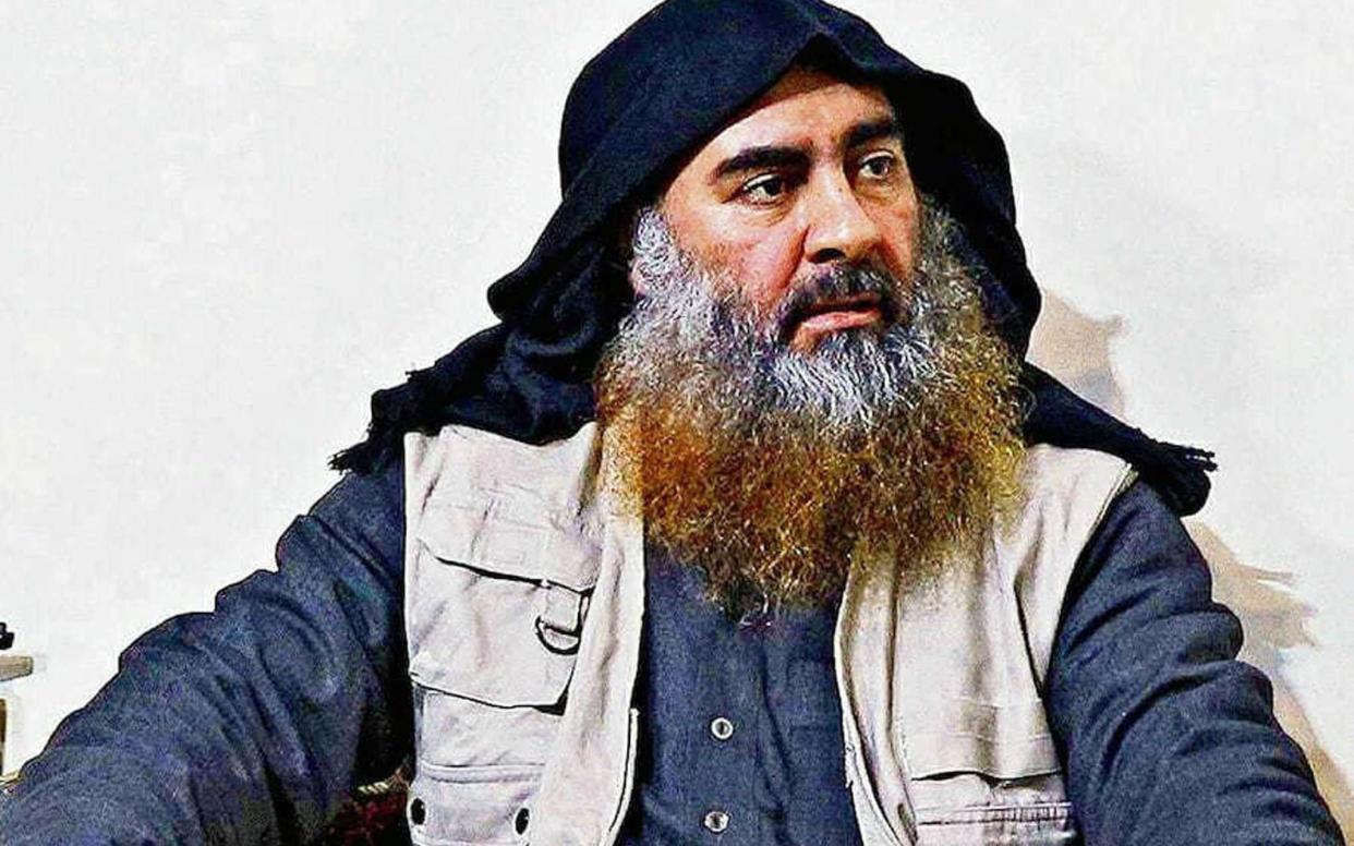 Abu Bakr Al-Baghdadi, the late Isil chief, killed himself and two children by detonating a suicide vest during a US raid in Syria - REX