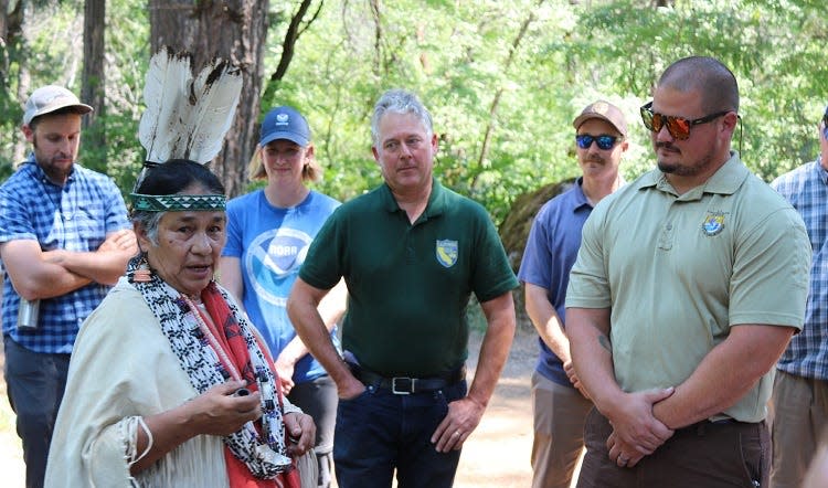 Caleen Sisk, chief and spiritual leader of the Winnemem Wintu Tribe, speaks during a ceremony when 20,000 winter-run chinook salmon eggs were placed in the McCloud River in July 2022.