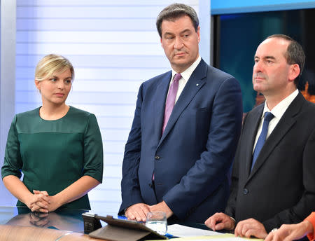 The Greens party leading candidate Katharina Schulze, Bavarian Prime Minister Markus Soeder and Free Voters of Bavaria (Freie Waehler Bayern) leading candidate Hubert Aiwanger take part in an interview at a TV studio following the Bavarian state election in Munich, Germany, October 14, 2018. Lukas Barth-Tuttas/Pool via Reuters