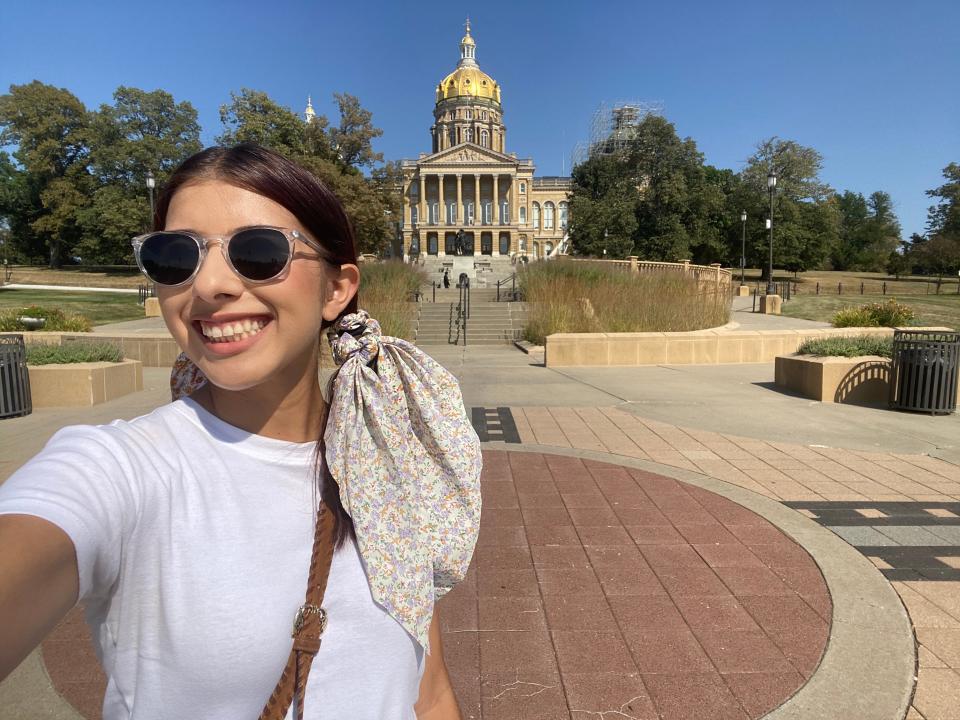 Des Moines Register reporter Paris Barraza takes a selfie outside the Iowa State Capitol in Des Moines on Sept. 8, 2023.
