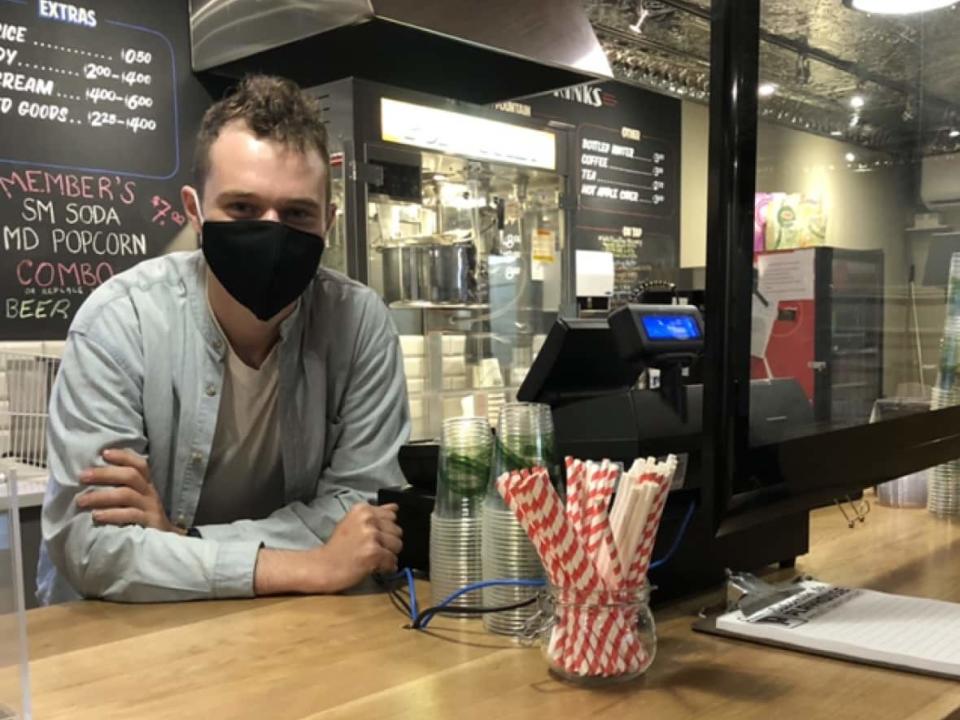 New provincial COVID-19 restrictions mean Jacob Tutt isn't allowed to sell food or drinks at his movie theatre, the Playhouse Cinema in Hamilton. 'I didn’t think there would be something like this.' (Samantha Craggs/CBC - image credit)