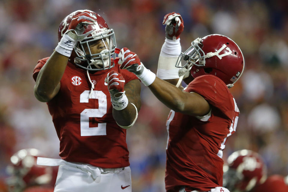 ATLANTA, GA - DECEMBER 5: Running back Derrick Henry #2 of the Alabama Crimson Tide celebrates with running back Kenyan Drake #17 of the Alabama Crimson Tides after scoring a second quarter touchdown against the Florida Gators during the SEC Championship at the Georgia Dome on December 5, 2015 in Atlanta, Georgia. (Photo by Kevin C. Cox/Getty Images)