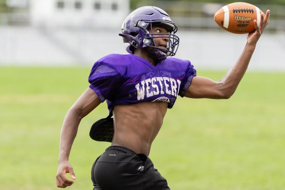 Western Beaver wide receiver Chris Kirkland catches with one hand during the team's heat acclimatization practice Aug. 8 at Western Beaver High School.