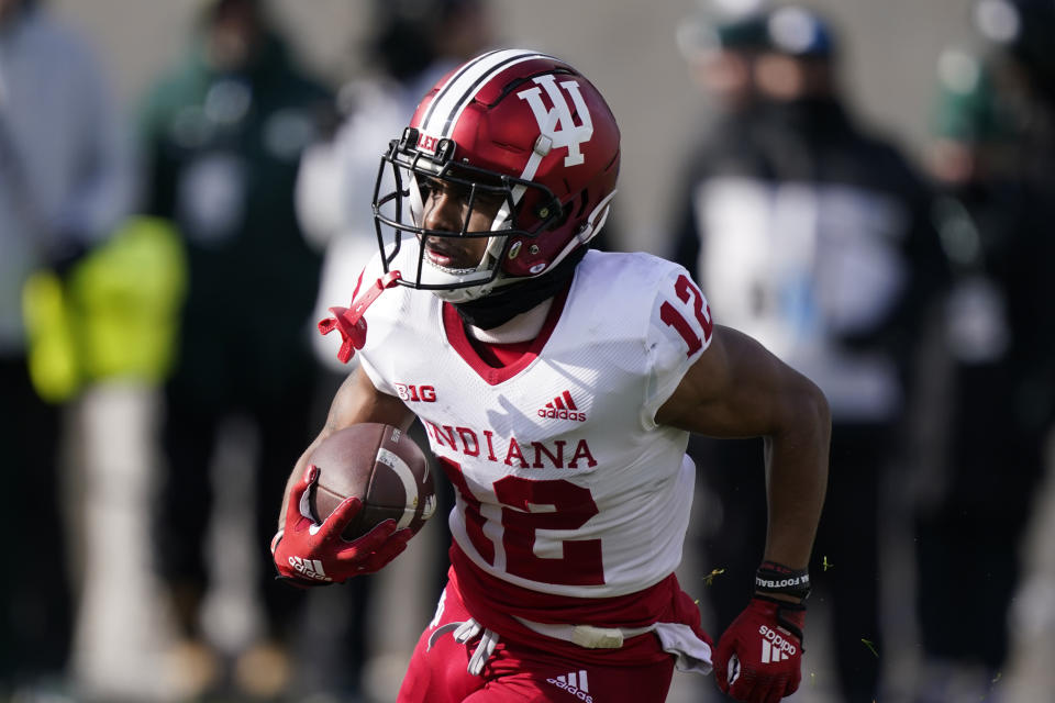 FILE - Indiana running back Jaylin Lucas rushes during the first half of the team's NCAA college football game against Michigan State, Nov. 19, 2022, in East Lansing, Mich. Indiana opens their season at home against Ohio State on Sept. 2. (AP Photo/Carlos Osorio, File)