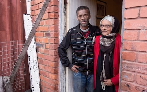 Shaida Adams, 73, and her son Turner, 54, were forcibly moved to the Lavender Hill township in the Apartheid era. Turner went on to become a feared gangster - Credit: Brenton Geach/The Telegraph