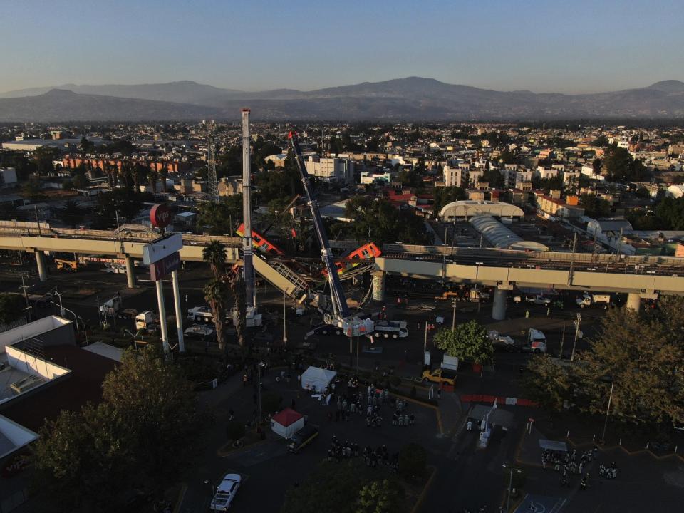 An aerial view of subway cars from a collapsed elevated section of the Metro line in Mexico City on Tuesday.