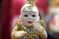 A "child angel" doll is pictured at a shop inside a department store in Bangkok, Thailand, January 26, 2016. REUTERS/Athit Perawongmetha