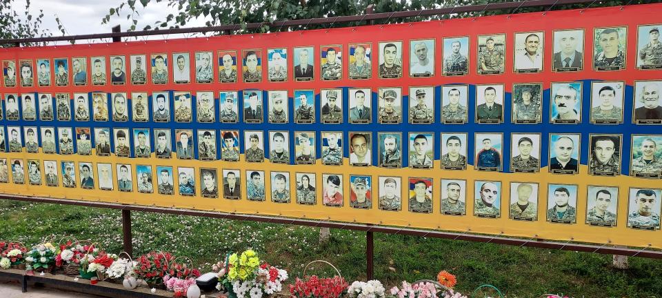 A memorial from the 2020 war in the region of Nagorno Karabagh, a historically Armenian populated enclave lying within the borders of present day Azerbaijan, adjacent to Armenia. It shows photos of all the fallen soldiers, flowers laid in front of them. It is in Stepanakert, the capital of Nagorno Karabagh.