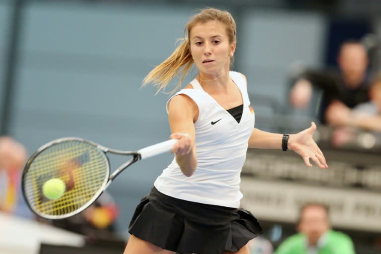 Germany's Annika Beck returns a ball to Swiss' Timea Bacsinszky during a Fed Cup tennis match in Leipzig, eastern Germany, on February 7, 2016