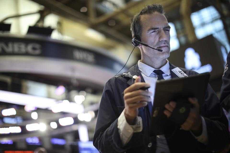 Traders and financial professionals work on the floor of the New York Stock Exchange (NYSE) at the opening bell on August 15, 2019 in New York City.