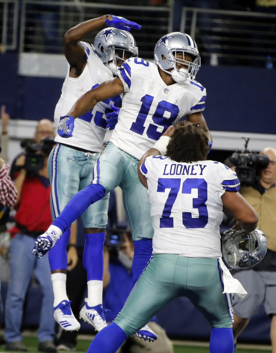 Dallas Cowboys wide receiver Amari Cooper (19) celebrates his touchdown against the Philadelphia Eagles in overtime of an NFL football game, in Arlington, Texas, Sunday, Dec. 9, 2018. (AP Photo/Michael Ainsworth)