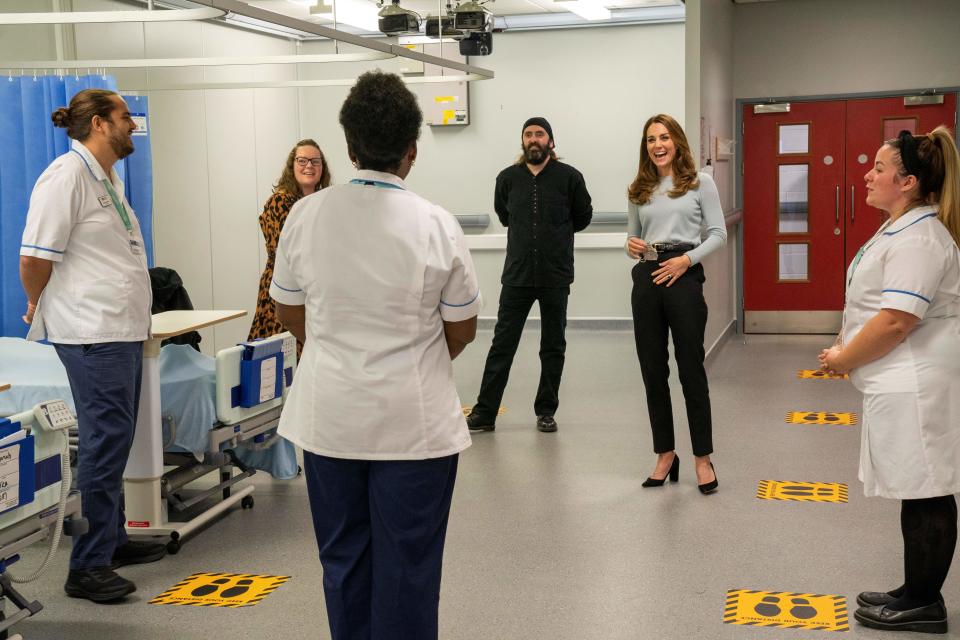 Britain's Catherine, Duchess of Cambridge gestures as she chats with students during her visit to the University of Derby in Derby, central England, on October 6, 2020, where she met students to hear how the novel coronavirus COVID-19 pandemic has impacted university life, and what national measures have been put in place to support student mental health. (Photo by Arthur EDWARDS / various sources / AFP) (Photo by ARTHUR EDWARDS/AFP via Getty Images)