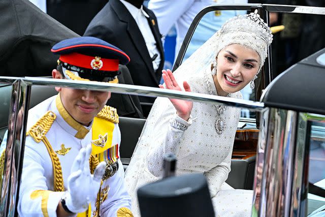 <p>MOHD RASFAN/AFP via Getty</p> Prince Abdul Mateen and Anisha at their wedding procession on Jan. 14, 2023