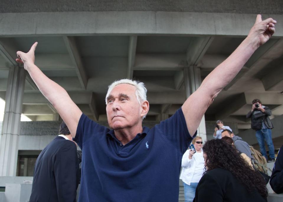 Roger Stone, a longtime adviser to US President Donald Trump, throws up peace signs outside court on Jan. 25, 2019 in Fort Lauderdale, Florida. | Joshua Prezant—AFP/Getty Images