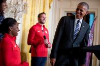 <p>President Barack Obama, accompanied by first lady Michelle Obama, and Paralympic Closing Ceremony flag bearer Army veteran Josh Brunais, center, smiles at US Olympics gymnast Simone Biles during a ceremony in the East Room of the White House in Washington, Thursday, Sept. 29, 2016, where the president honored members of the 2016 United States Summer Olympic and Paralympic Teams. (AP Photo/Andrew Harnik)</p>
