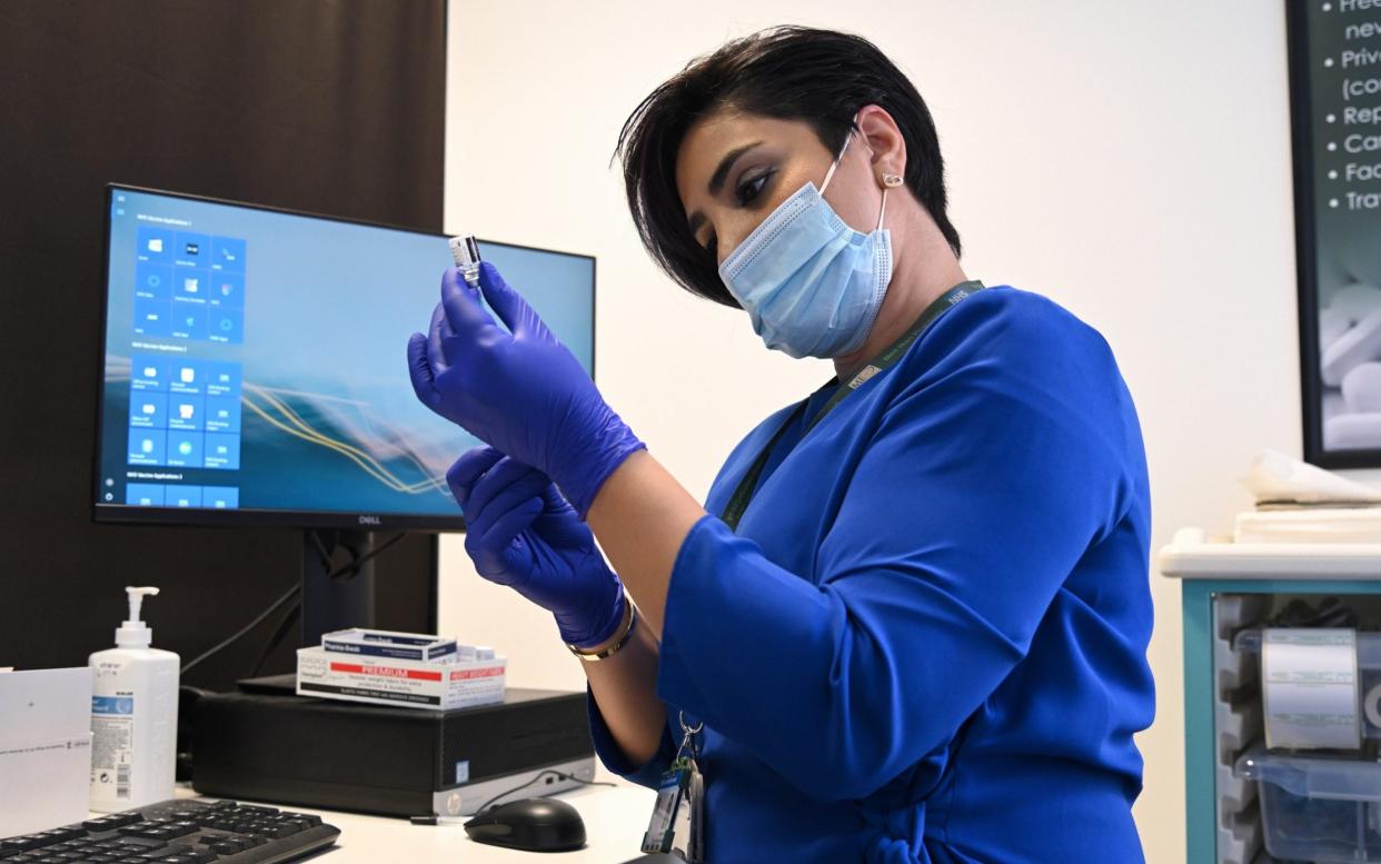 A health worker prepares a booster jab - Karwai Tang/Getty Images Europe