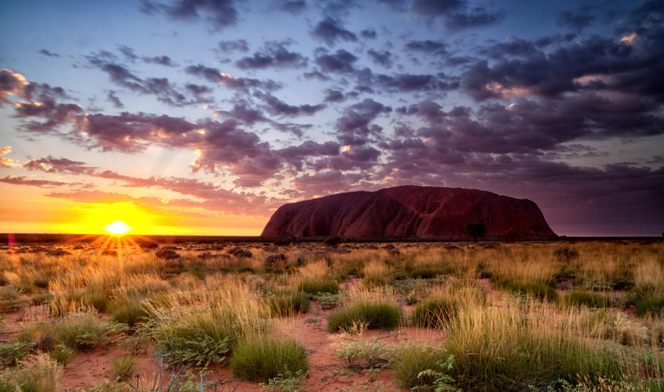 Nick, Colin, Alistair, Mehmet and Lionel escape the Macau bachelor party to relax in Australia's Northern Territory. They drink flat whites while gazing at Uluru, aka Ayers Rock, a massive sandstone monolith.