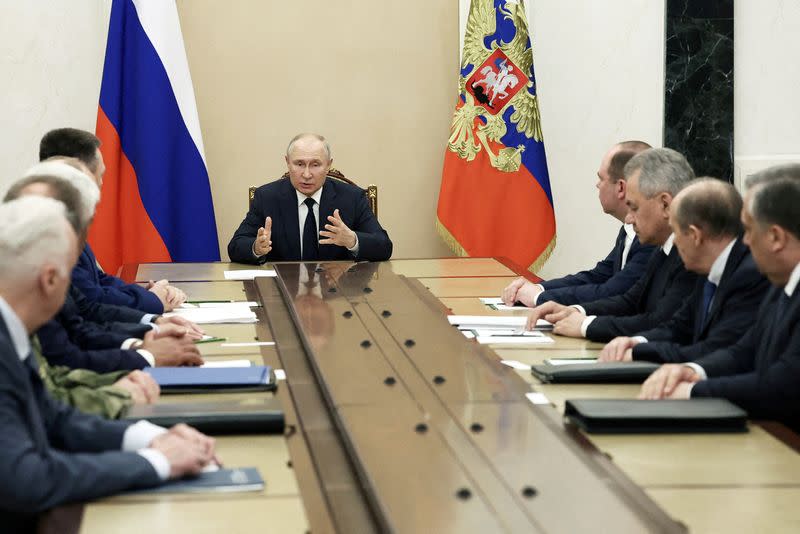 FILE PHOTO: Russian President Vladimir Putin holds a meeting with heads of Russian security services in Moscow
