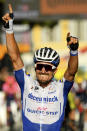 France's Julian Alaphilippe crosses the finish line to win the second stage of the Tour de France cycling race over 186 kilometers (115,6 miles) with start and finish in Nice, southern France, Sunday, Aug. 30, 2020. (Stuart Franklin/Pool photo via AP)