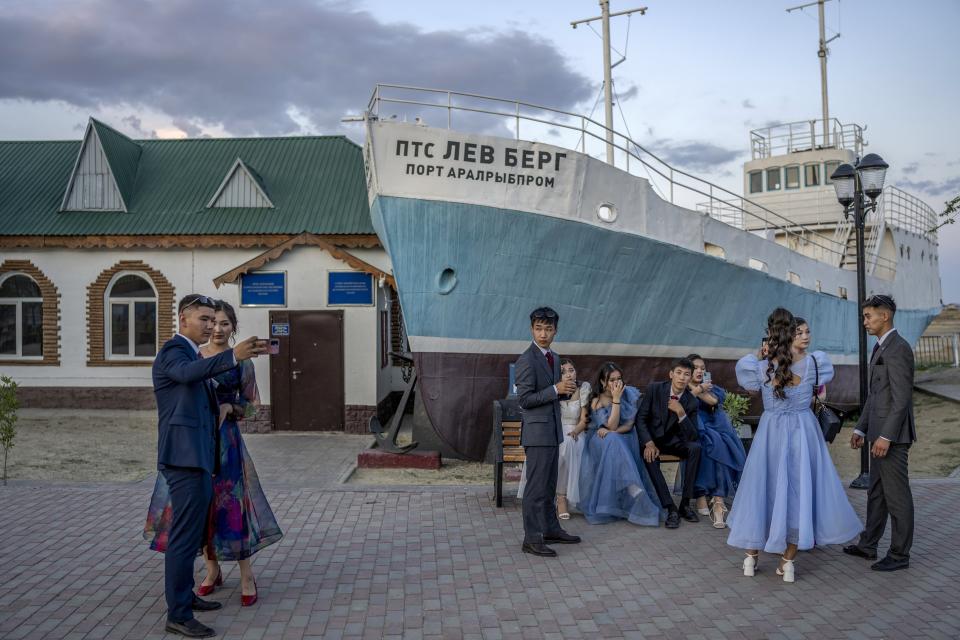Youths gather to celebrate graduation in the area that used to be the main port of the region before the Aral Sea dried up, Aralsk, Kazakhstan, Wednesday, July 5, 2023. (AP Photo/Ebrahim Noroozi)