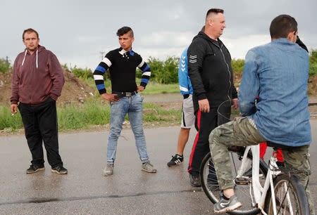 Roma people gather on the outskirts of the town to commemorate the killings of Roma people by right-wing militants in 2009, in Torokszentmiklos, Hungary, May 21, 2019. REUTERS/Bernadett Szabo