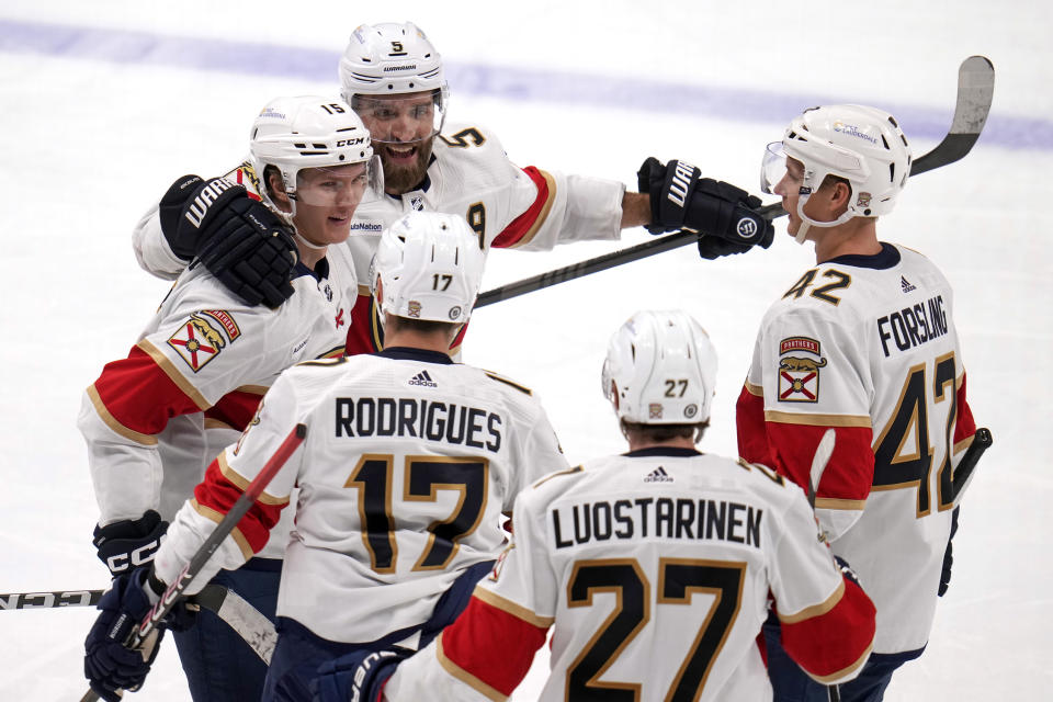 Florida Panthers' Anton Lundell (15) celebrates his second goal of the game during the third period of an NHL hockey game against the Pittsburgh Penguins in Pittsburgh, Wednesday, Feb. 14, 2024. The Panthers won 5-2. (AP Photo/Gene J. Puskar)