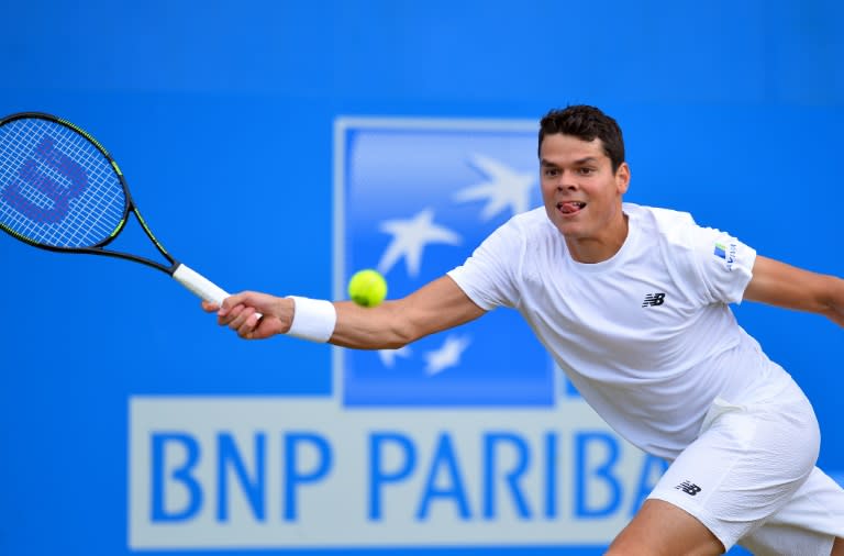 Canada's Milos Raonic returns against Spain's Roberto Bautista Agut in their men's singles quarter-final match in the ATP Aegon Championships tennis tournament at the Queen's Club in west London on June 17, 2016