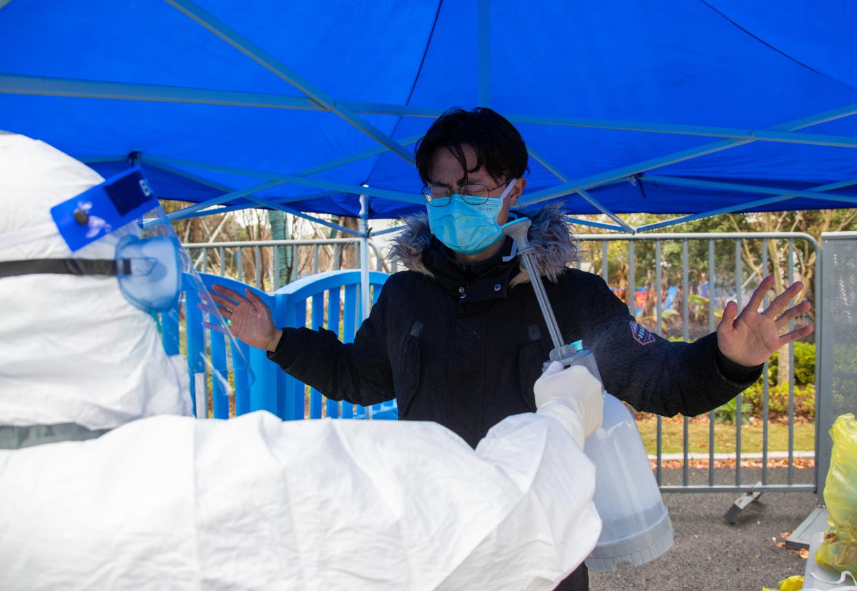 WUHAN, CHINA - MARCH 2, 2020 -A covid-19 cured patient was disinfected at discharge, in the Fangcang Hospital of Wuhan Sports Center, the cured patients were discharged in an orderly line. Wuhan, Hubei Province, China, March 2, 2020. On the same day, 164 patients in Wuhan Sports Center shelter hospital were cured and discharged, the highest number of discharged since the operation of Wuhan Sports Center shelter hospital. As of 18:00 on March 2, the fangcang Hospital of Wuhan Sports Center has received 1056 people in total and 596 people out of the hospital in total. - PHOTOGRAPH BY Costfoto / Barcroft Studios / Future Publishing (Photo credit should read Costfoto/Barcroft Media via Getty Images)