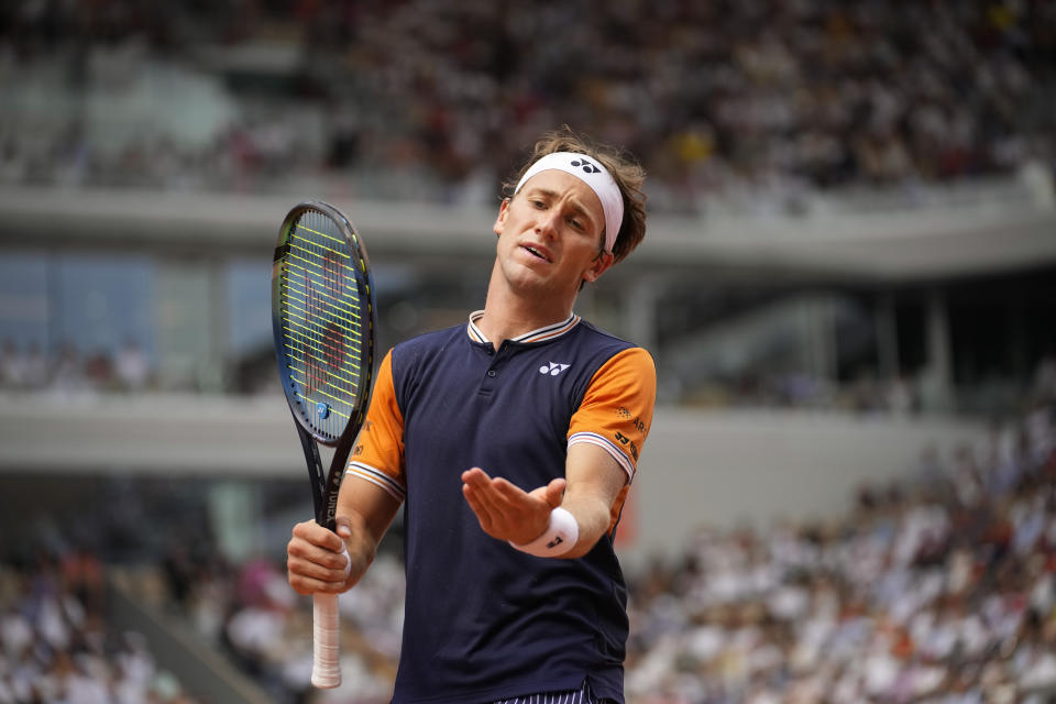 Norway's Casper Ruud reacts after missing a shot against Serbia's Novak Djokovic during the men's singles final match of the French Open tennis tournament at the Roland Garros stadium in Paris, Sunday, June 11, 2023. (AP Photo/Christophe Ena)