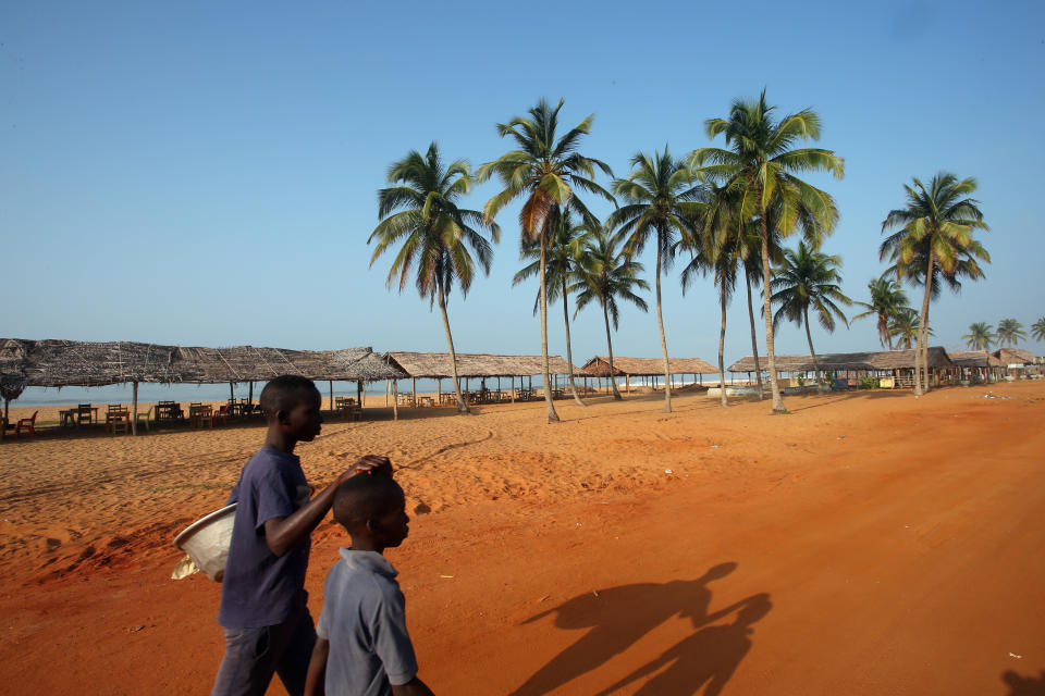 Young boys walk along a beach where slaves were once loaded onto ships in the historic slave port of Ouidah, Benin. (Photo: Afolabi Sotunde/Reuters)