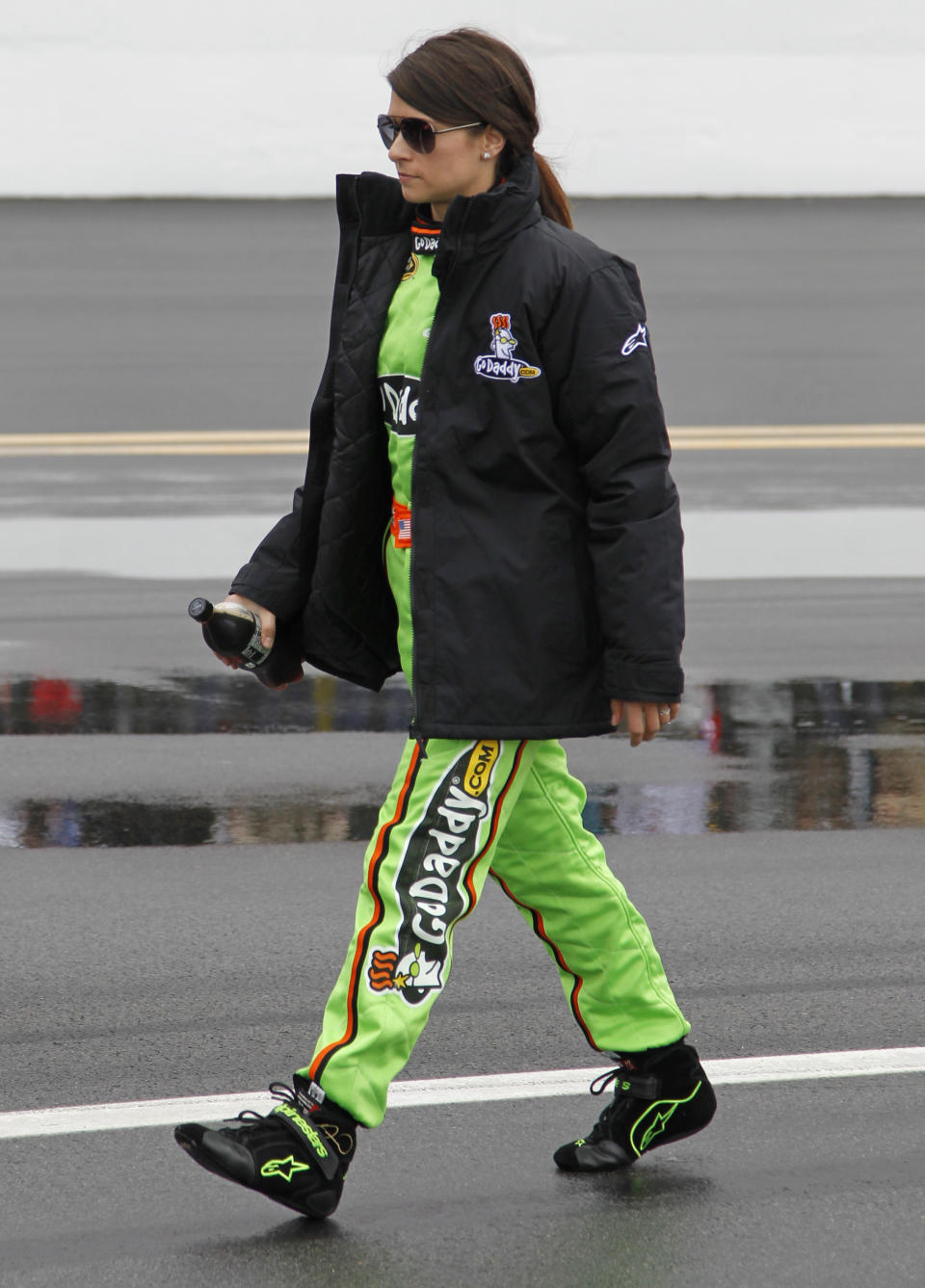 Danica Patrick walks down pit road during driver introductions before the NASCAR Daytona 500 Sprint Cup series auto race in Daytona Beach, Fla., Sunday, Feb. 26, 2012. (AP Photo/Terry Renna)