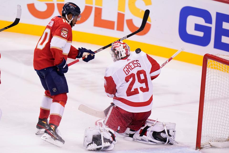 The puck gets behind Detroit Red Wings goaltender Thomas Greiss (29) as Florida Panthers left wing Anthony Duclair (10) attempts a shot during the second period Saturday, March 5, 2022, in Sunrise, Fla.