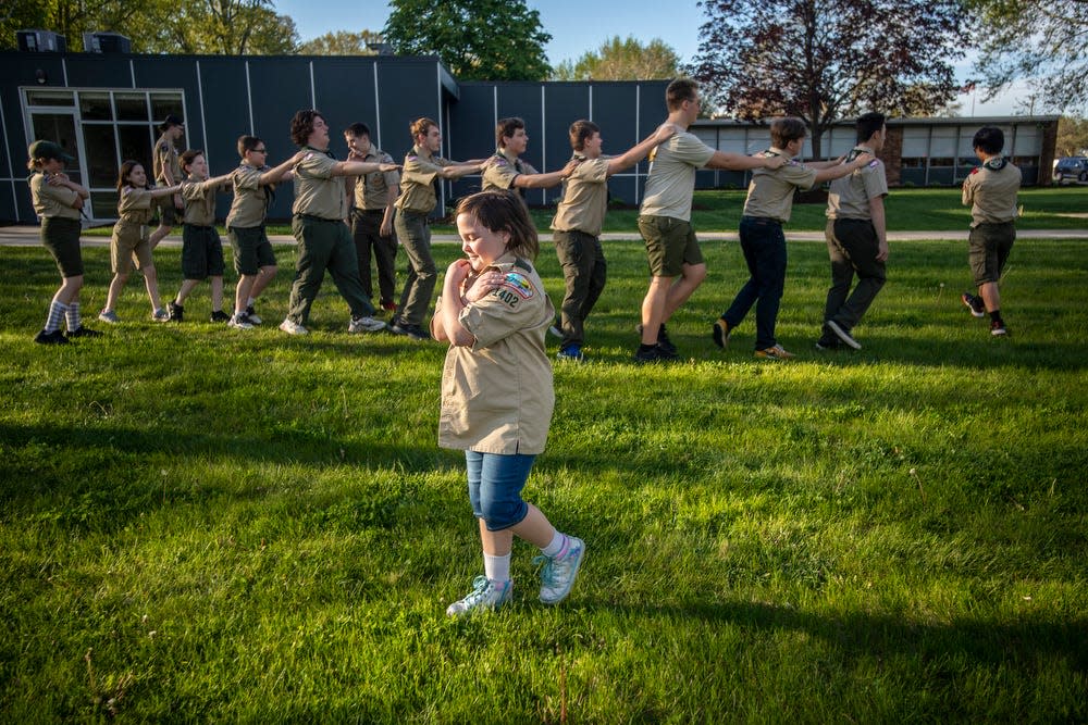 Sara White, 10, center, participates in a game of Peru as a team building exercise during a troop meeting at St. Pio of Pietrelcina in Roseville on Friday, May 13, 2022.  In 2019, BSA announced girls were allowed to join. The organization changed its name from Boy Scouts to Scouts BSA. 