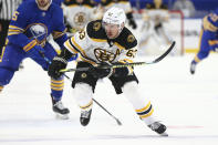 Boston Bruins forward Brad Marchand (63) skates up ice during the first period of an NHL hockey game against the Buffalo Sabres, Tuesday, April 20, 2021, in Buffalo, N.Y. (AP Photo/Jeffrey T. Barnes)
