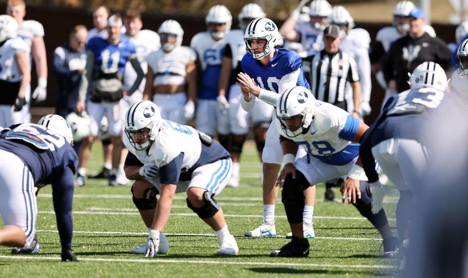 Quarterback Kedon Slovis calls the signals at the line as BYU practices in Provo on Friday, March 17, 2023.