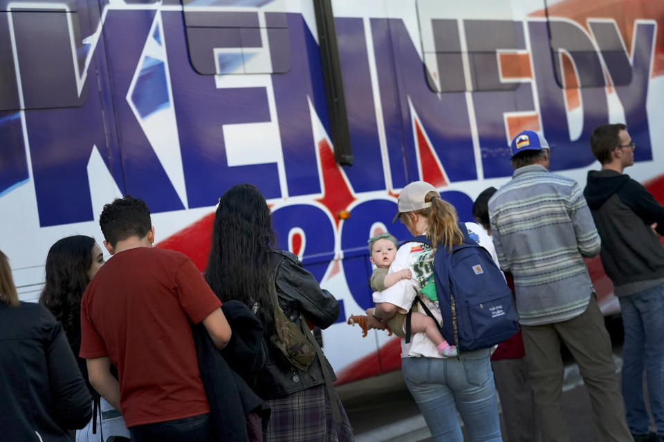 Voters wait to enter a voter rally for Independent presidential candidate Robert F. Kennedy Jr., Wednesday, Dec. 20, 2023, in Phoenix. (AP Photo/Matt York)