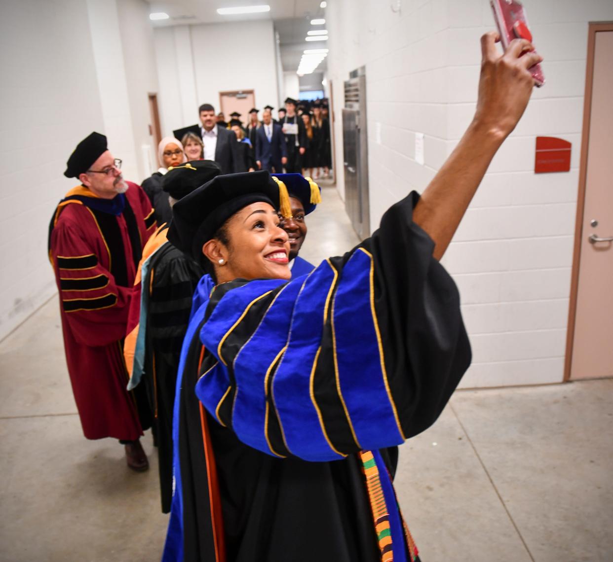St. Cloud Technical & Community College president Annesa Cheek takes a selfie before the start of commencement exercises Friday, May 17, 2019, at the River's Edge Convention Center in St. Cloud.