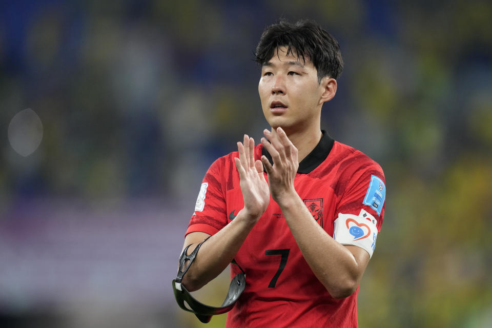 South Korea's Son Heung-min applauds the fans after losing 4-1 during the World Cup round of 16 soccer match between Brazil and South Korea at the Stadium 974 in Doha, Qatar, Monday, Dec. 5, 2022. (AP Photo/Jin-Man Lee)