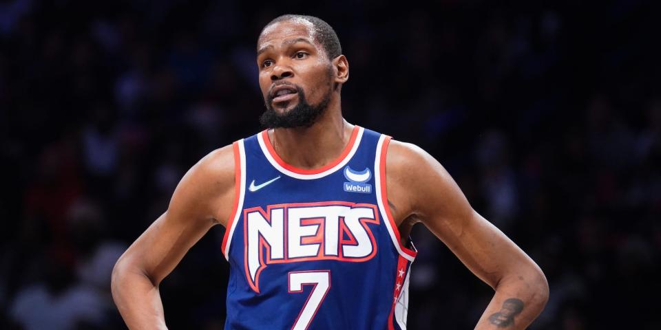 Kevin Durant stands with his hands on his hips during a game in 2022.