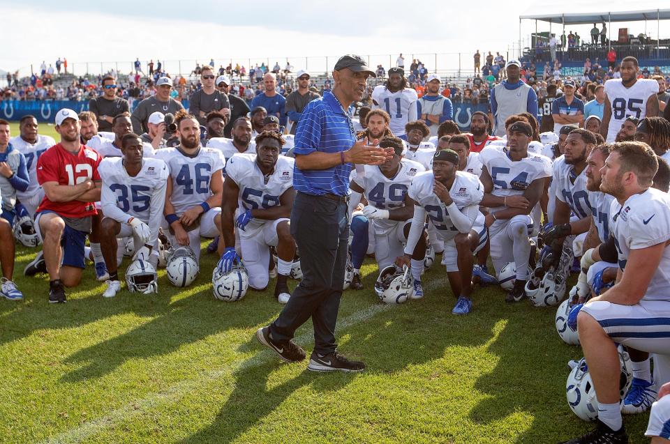 Former Indianapolis Colts head coach Tony Dungy talks to players during a 2019 practice.