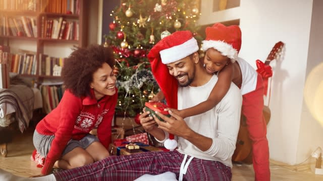 Family opening Christmas gifts.