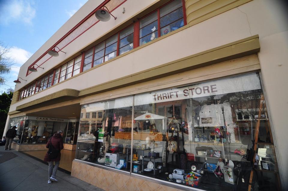 Exterior of a rundown thrift store.