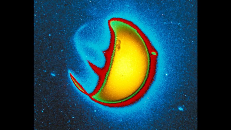 An image of Earth taken by the Far Ultraviolet Camera/Spectrograph, designed and built by George R. Carruthers.