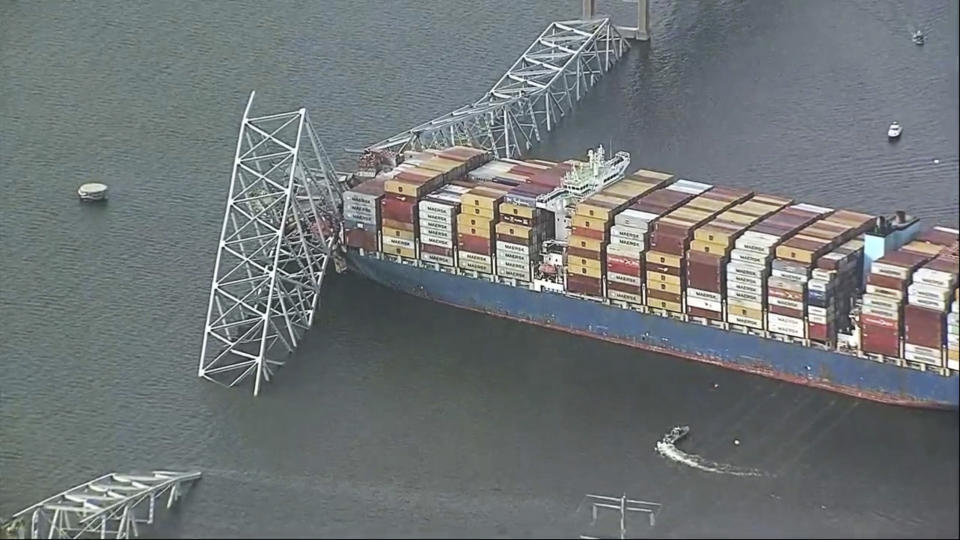 Parts of the Francis Scott Key Bridge remain after a container ship collided with one of the bridge’s support Tuesday, March 26, 2024 in Baltimore. The major bridge in Baltimore snapped and collapsed after a container ship rammed into it early Tuesday, and several vehicles fell into the river below. Rescuers were searching for multiple people in the water. (WJLA via AP)