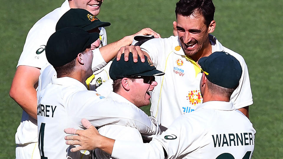 Mitchell Starc, pictured here celebrating with Steve Smith after the dismissal of Dawid Malan.