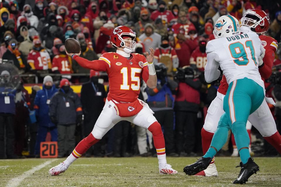 Jan 13, 2024; Kansas City, Missouri, USA; Kansas City Chiefs quarterback Patrick Mahomes (15) throws under pressure from Miami Dolphins defensive end Emmanuel Ogbah (91) during the first half of the 2024 AFC wild card game at GEHA Field at Arrowhead Stadium. Mandatory Credit: Denny Medley-USA TODAY Sports