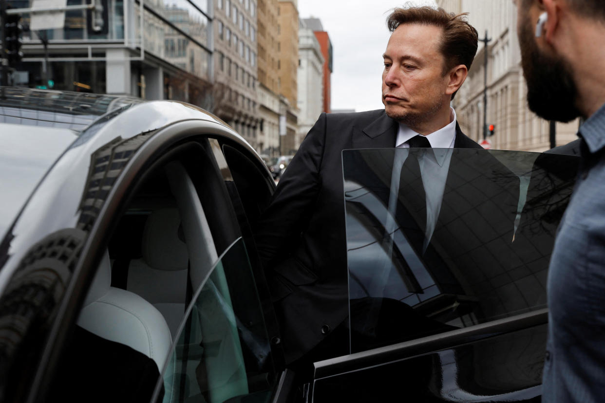 Tesla CEO Elon Musk and his security detail depart the company’s local office in Washington, U.S. January 27, 2023.  REUTERS/Jonathan Ernst